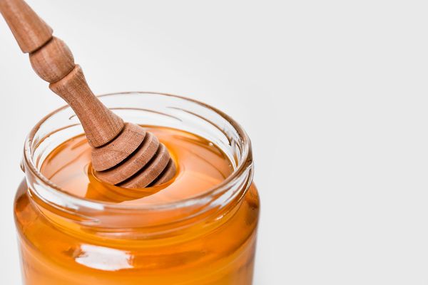Honey jar with wooden dipper